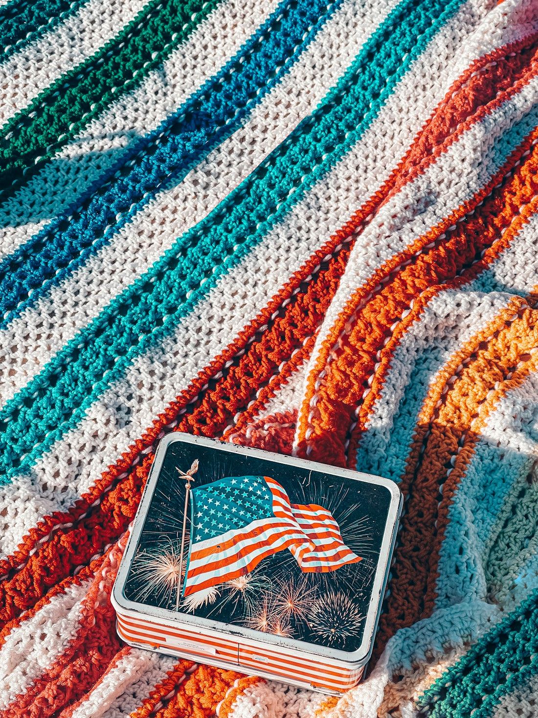 a crocheted blanket with an american flag on it